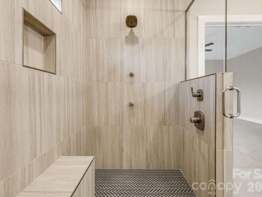 17 Baxter Woods Lane, Candler, NC 28715.  MLS# CAR4370990, YatesRealty ID 21147. Primary shower
