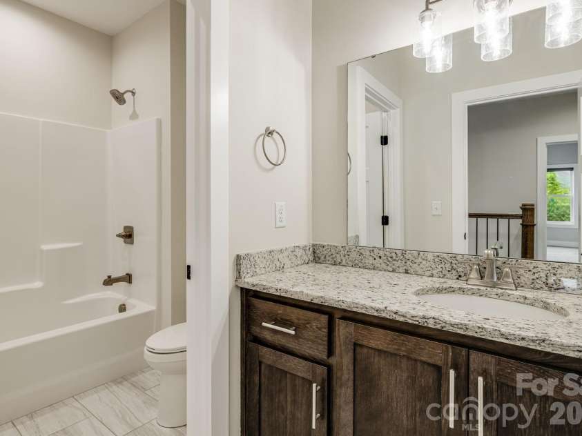 17 Baxter Woods Lane, Candler, NC 28715.  MLS# CAR4370990, YatesRealty ID 21147. Upper Level Bathroom