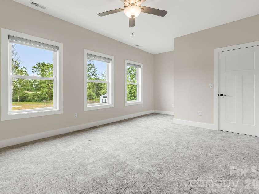 17 Baxter Woods Lane, Candler, NC 28715.  MLS# CAR4370990, YatesRealty ID 21147. Upper Level Bedroom 1