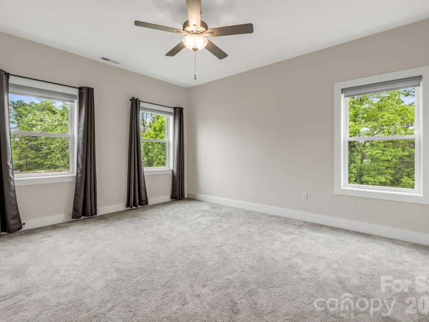 17 Baxter Woods Lane, Candler, NC 28715.  MLS# CAR4370990, YatesRealty ID 21147. Upper Level Bedroom 2