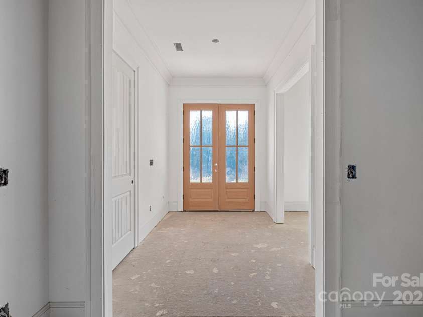 5039 Eliza Long Wilkie Drive, Huntersville, NC 28078.  MLS# CAR4240694, YatesRealty ID 21152. Beautiful double front door awaiting your stain choice