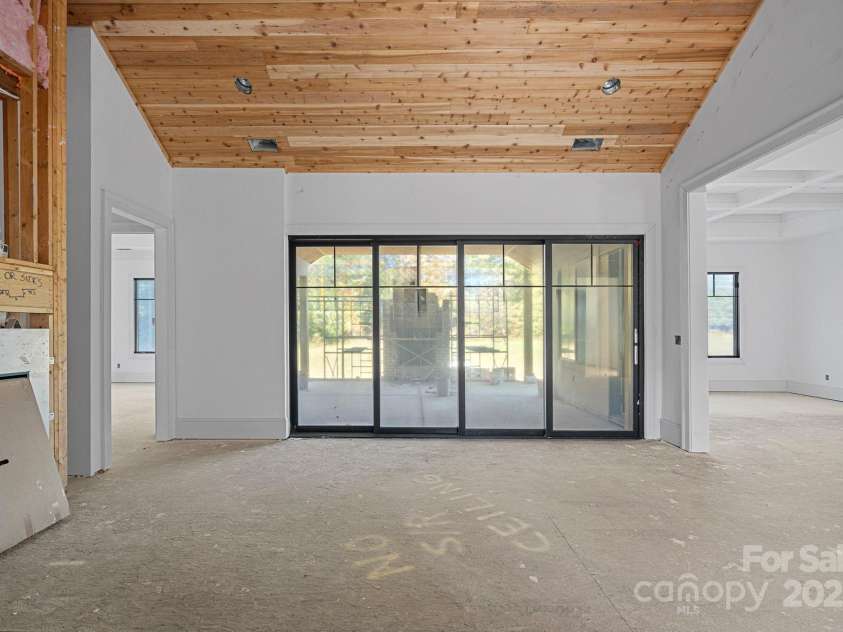 5039 Eliza Long Wilkie Drive, Huntersville, NC 28078.  MLS# CAR4240694, YatesRealty ID 21152. Great room with Anderson panoramic sliders