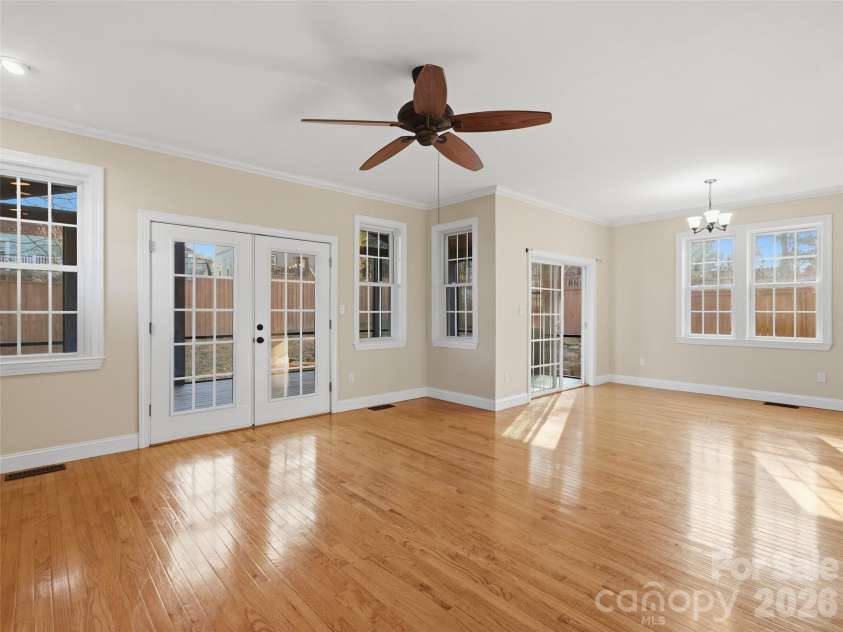 92 Middlemont Avenue, Asheville, NC 28806.  MLS# CAR4334470, YatesRealty ID 21159. Dining and den access to the large screened porch at the rear of this home