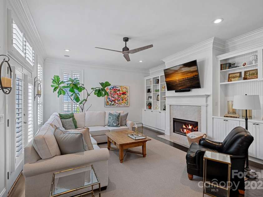 202 Caldwell Lane, Davidson, NC 28036.  MLS# CAR4269937, YatesRealty ID 21169. Beautiful family room off the kitchen with custom built-in cabinets and new gas logs in the fireplace