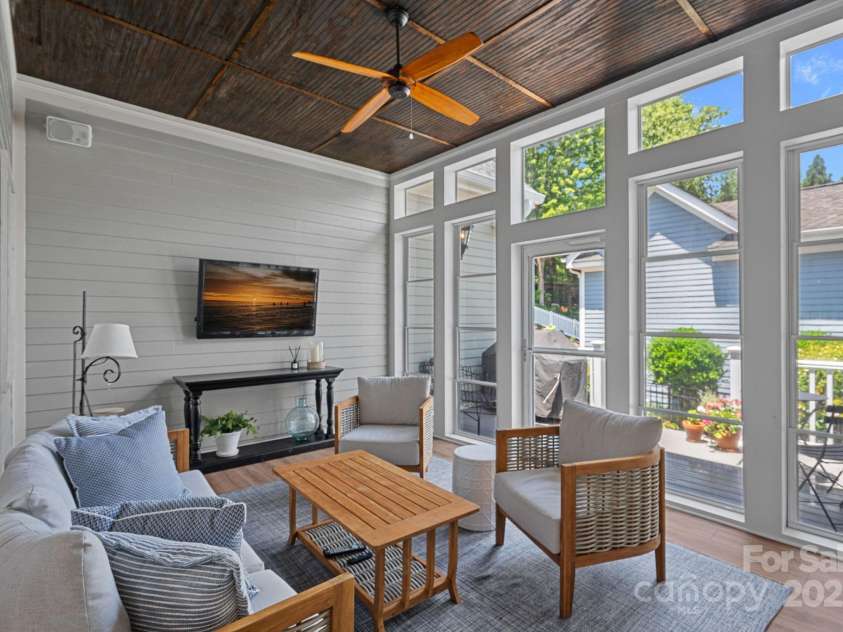202 Caldwell Lane, Davidson, NC 28036.  MLS# CAR4269937, YatesRealty ID 21169. Enjoy a morning coffee or an afternoon/evening beverage on the screened-in porch with new Eze-Breeze windows