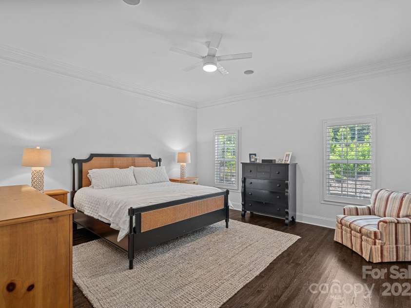 202 Caldwell Lane, Davidson, NC 28036.  MLS# CAR4269937, YatesRealty ID 21169. Large main-level primary suite with ensuite bathroom and walk-in closets