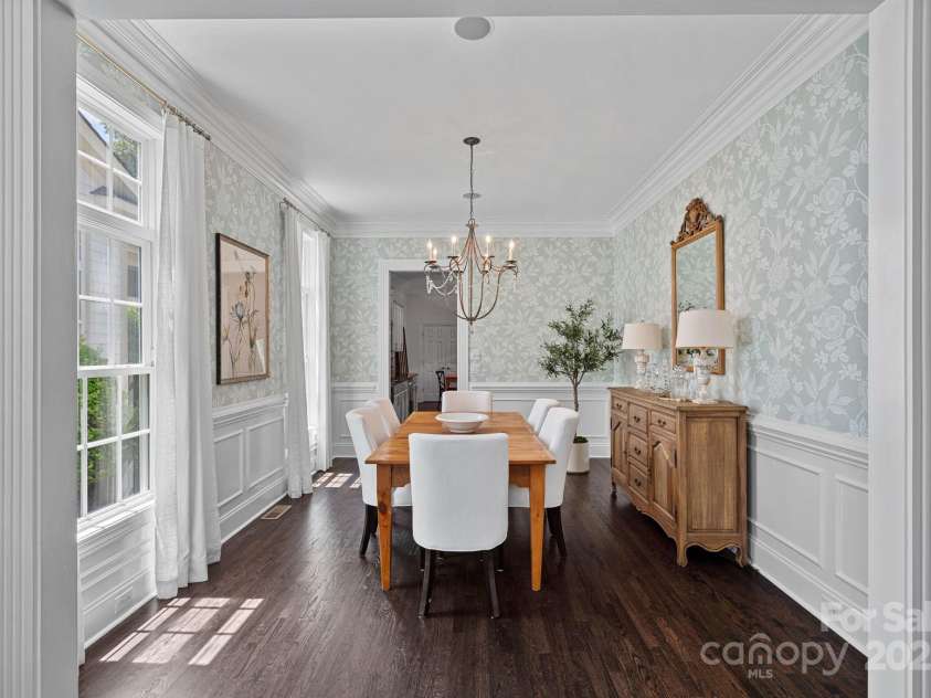 202 Caldwell Lane, Davidson, NC 28036.  MLS# CAR4269937, YatesRealty ID 21169. Spacious formal dining room with beautiful wainscoting and crown molding