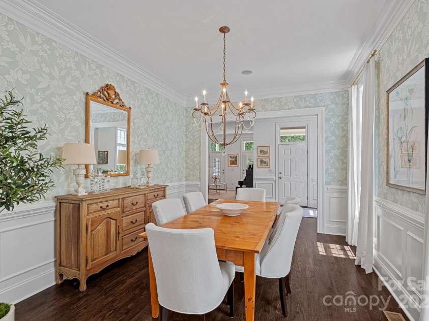 202 Caldwell Lane, Davidson, NC 28036.  MLS# CAR4269937, YatesRealty ID 21169. Spacious formal dining room with beautiful wainscoting and crown molding