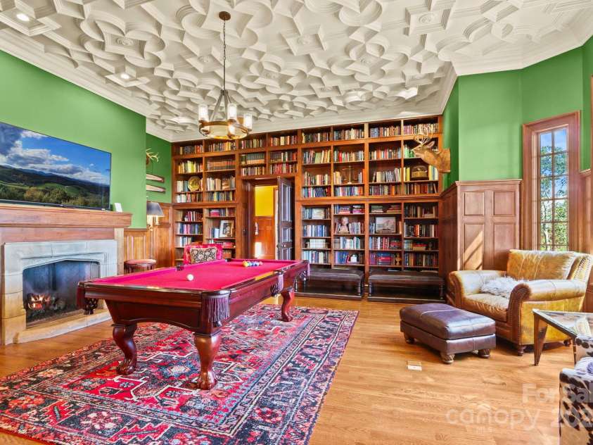 5742 NC Highway 194 None, Banner Elk, NC 28604.  MLS# CAR4309269, YatesRealty ID 2117. Library & billiards room with antique stone fireplace