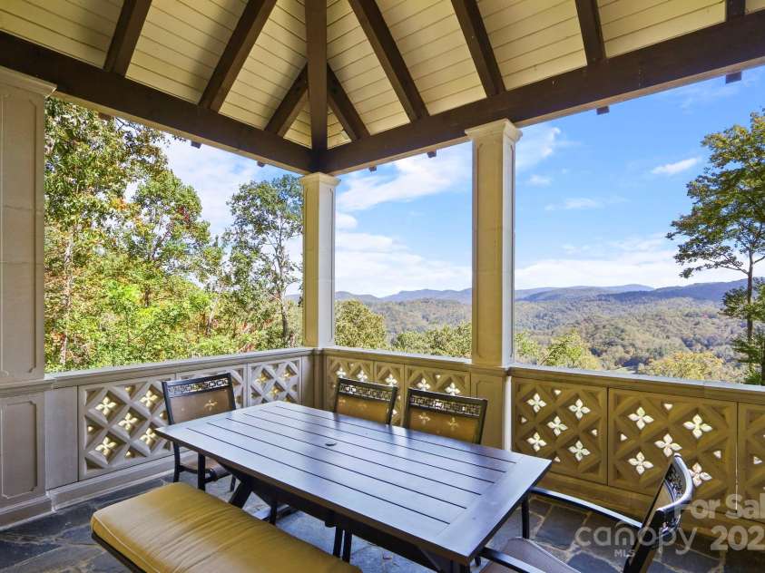 5742 NC Highway 194 None, Banner Elk, NC 28604.  MLS# CAR4309269, YatesRealty ID 2117. Long-range, layered blue ridge mountain & Valle Crucis pasture views from the patio