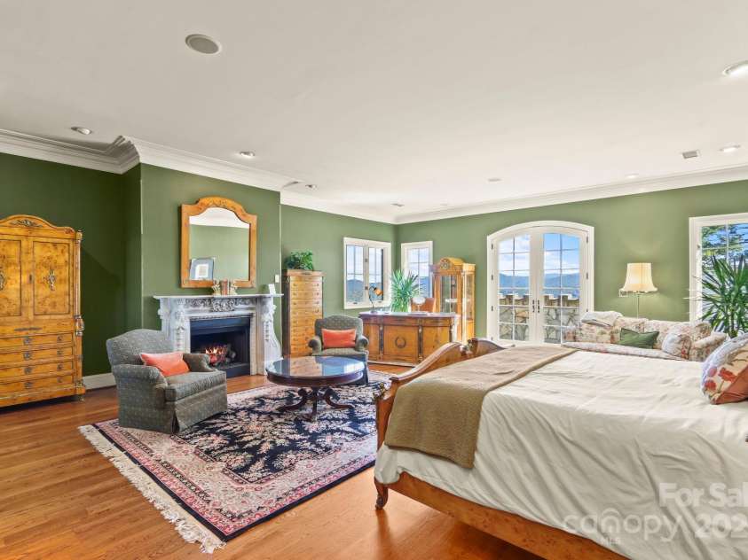 5742 NC Highway 194 None, Banner Elk, NC 28604.  MLS# CAR4309269, YatesRealty ID 2117. Second-level primary suite with antique stone fireplace and private stone balcony
