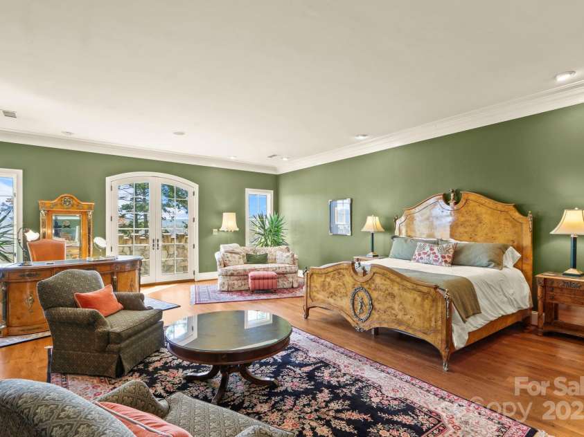 5742 NC Highway 194 None, Banner Elk, NC 28604.  MLS# CAR4309269, YatesRealty ID 2117. Second-level primary suite with antique stone fireplace and private stone balcony