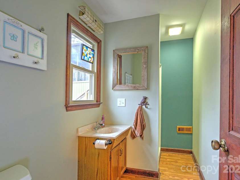 9374 Holbert Cove Road, Saluda, NC 28773.  MLS# CAR4227535, YatesRealty ID 2117. Bath off Family room