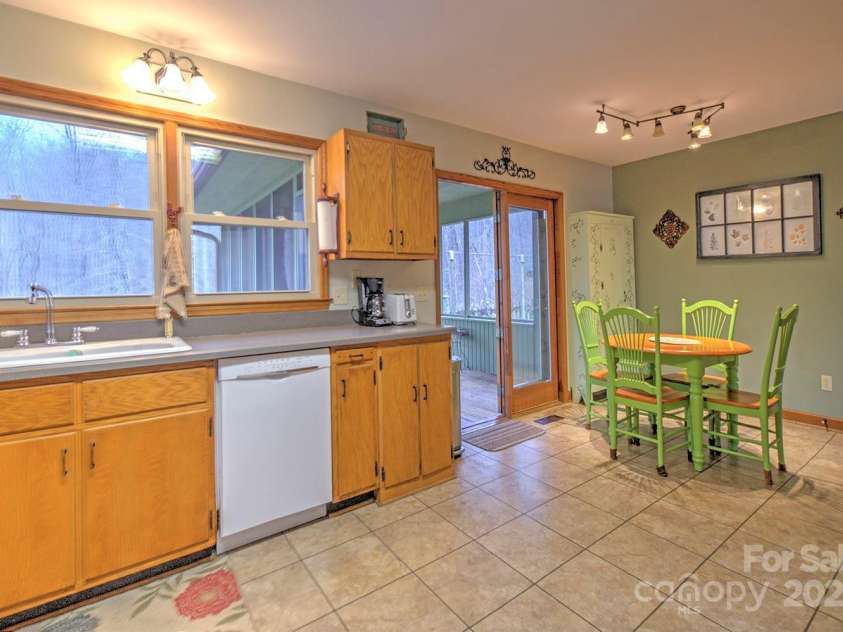 9374 Holbert Cove Road, Saluda, NC 28773.  MLS# CAR4227535, YatesRealty ID 2117. Kitchen and dining area