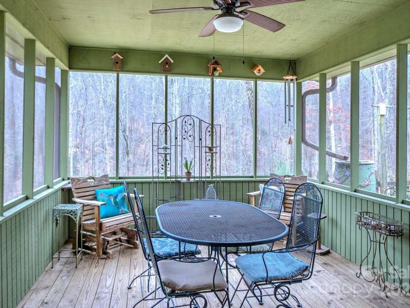 9374 Holbert Cove Road, Saluda, NC 28773.  MLS# CAR4227535, YatesRealty ID 2117. Screened in Porch off dining area