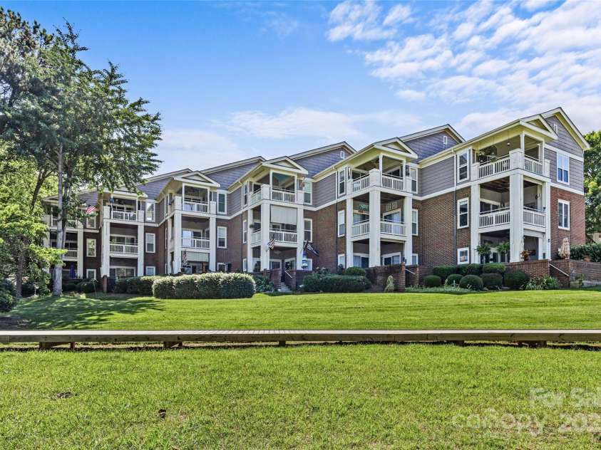 7845 Village Harbor Drive, Cornelius, NC 28031.  MLS# CAR4268319, YatesRealty ID 21175. 7845 is on the 2nd floor and is in the 5th row  from the lake.