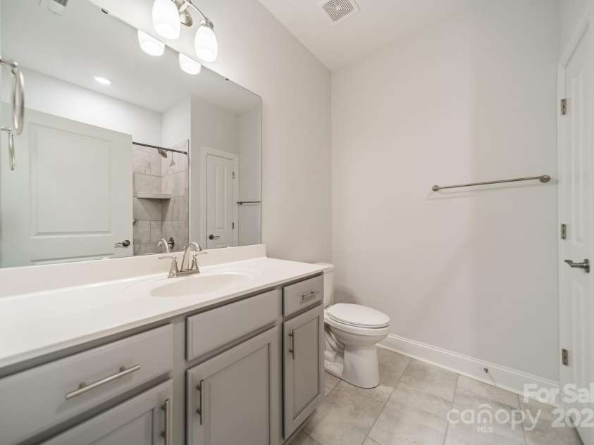 1005 Headwaters Court, Matthews, NC 28104.  MLS# CAR4233423, YatesRealty ID 21177. Guest bathroom