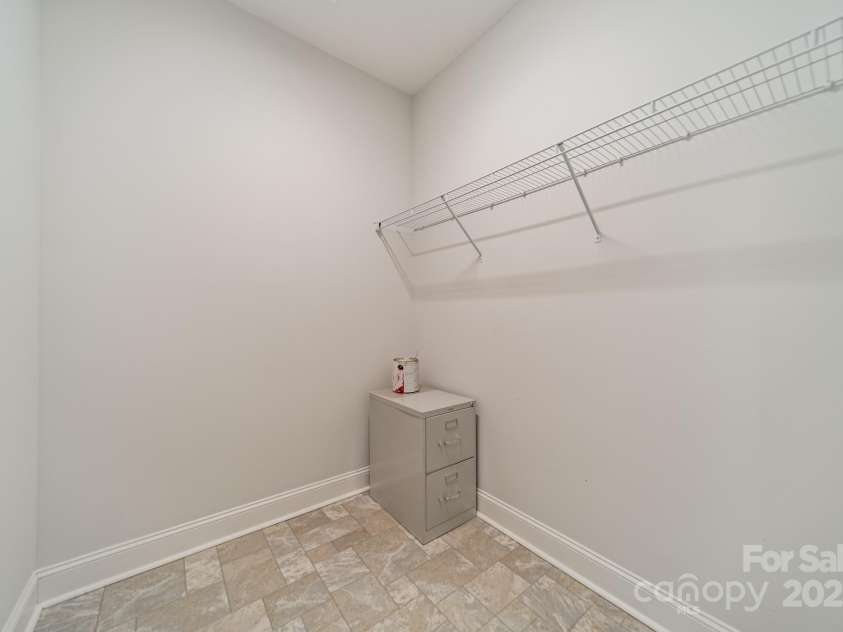 1005 Headwaters Court, Matthews, NC 28104.  MLS# CAR4233423, YatesRealty ID 21177. Large storage closet next to the laundry room