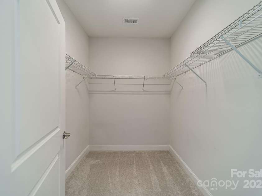 1005 Headwaters Court, Matthews, NC 28104.  MLS# CAR4233423, YatesRealty ID 21177. Primary bedroom walk-in closet