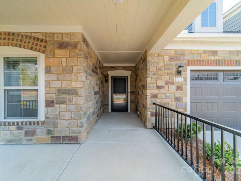 1005 Headwaters Court, Matthews, NC 28104.  MLS# CAR4233423, YatesRealty ID 21177. Rocking chair front porch