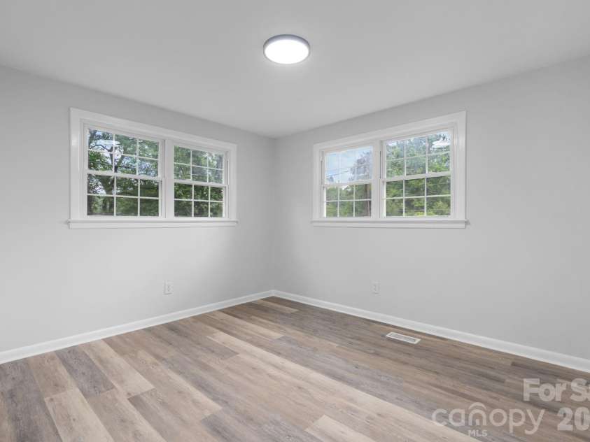 1871 Crestview Drive, Newton, NC 28658.  MLS# CAR4379075, YatesRealty ID 21177. Front Corner Bedroom