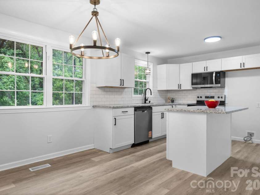 1871 Crestview Drive, Newton, NC 28658.  MLS# CAR4379075, YatesRealty ID 21177. Kitchen and Dining Room