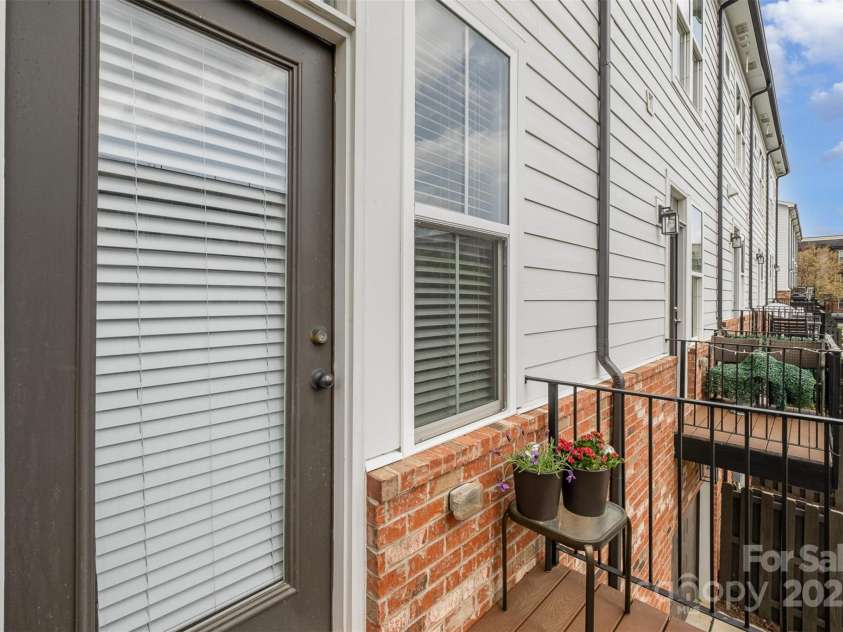 791 Seigle Point Drive, Charlotte, NC 28204.  MLS# CAR4243116, YatesRealty ID 21182. Balcony off of the kitchen