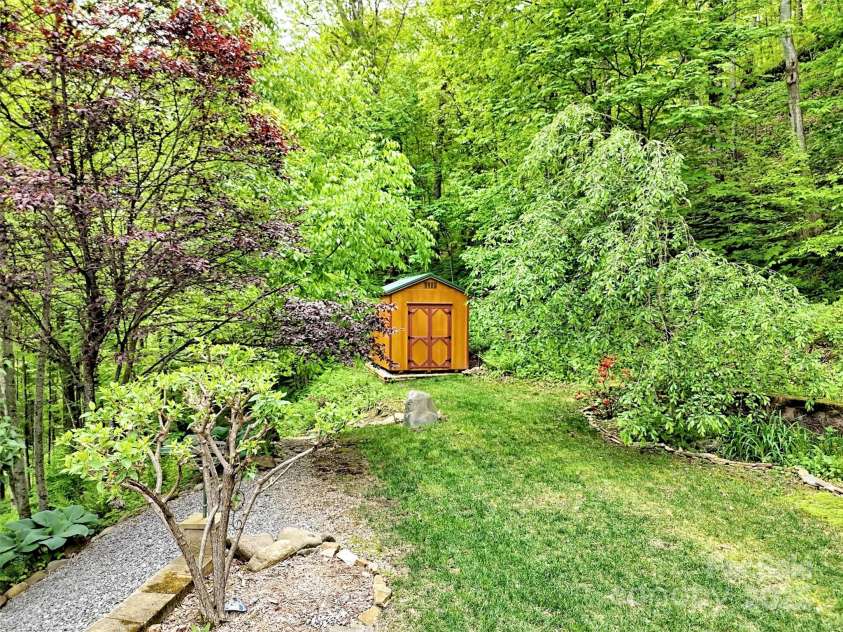 421 Ramp Patch Lane, Waynesville, NC 28786.  MLS# CAR4257466, YatesRealty ID 21184. Shed & Lush Landscaping