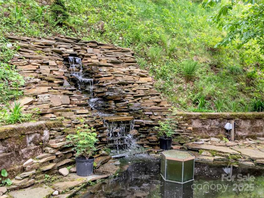 421 Ramp Patch Lane, Waynesville, NC 28786.  MLS# CAR4257466, YatesRealty ID 21184. Stunning Waterfall