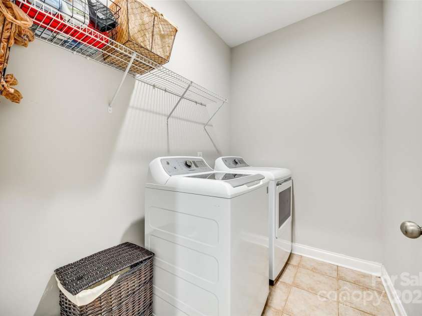 1813 Robbins Meadows Drive, Waxhaw, NC 28173.  MLS# CAR4242348, YatesRealty ID 21189. Main level laundry room