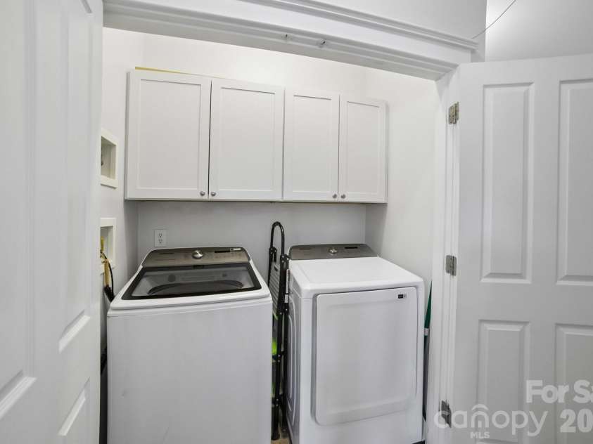 13624 Morehouse Street, Huntersville, NC 28078.  MLS# CAR4371007, YatesRealty ID 21192. Laundry closet conveniently located on the same level as all of the bedrooms. Upper storage cabinets. Washer and dryer come with the property