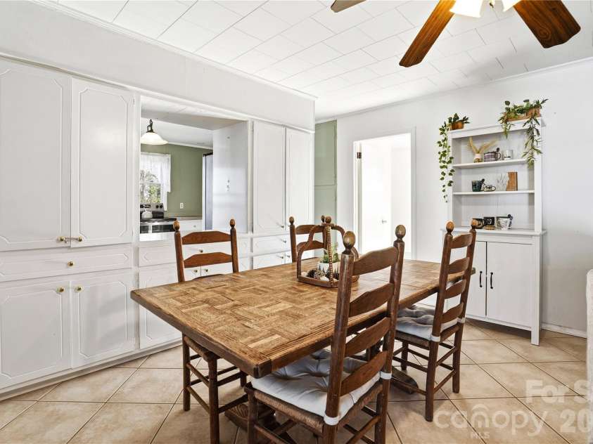 7775 Marlette Lane, Sherrills Ford, NC 28673.  MLS# CAR4341133, YatesRealty ID 2121. Casual dining space with built-in storage for effortless organization.