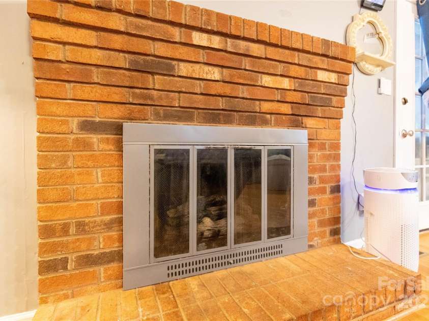 115 Setter Court, Statesville, NC 28625.  MLS# CAR4222635, YatesRealty ID 21211. Brick fireplace