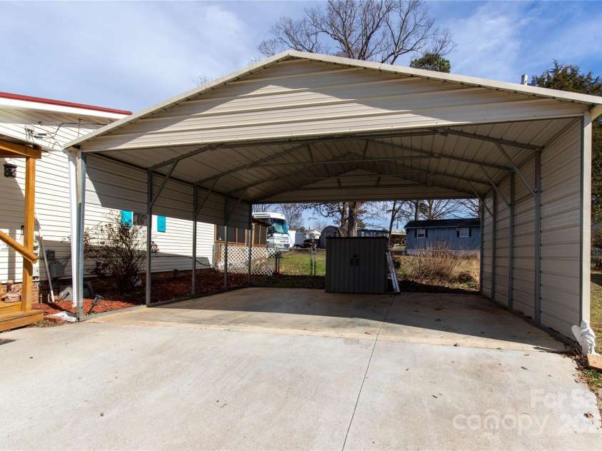 115 Setter Court, Statesville, NC 28625.  MLS# CAR4222635, YatesRealty ID 21211. Carport with lots of space
