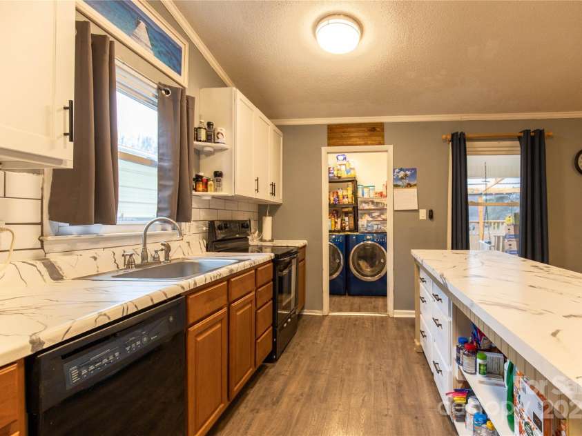 115 Setter Court, Statesville, NC 28625.  MLS# CAR4222635, YatesRealty ID 21211. Dishwasher with window view