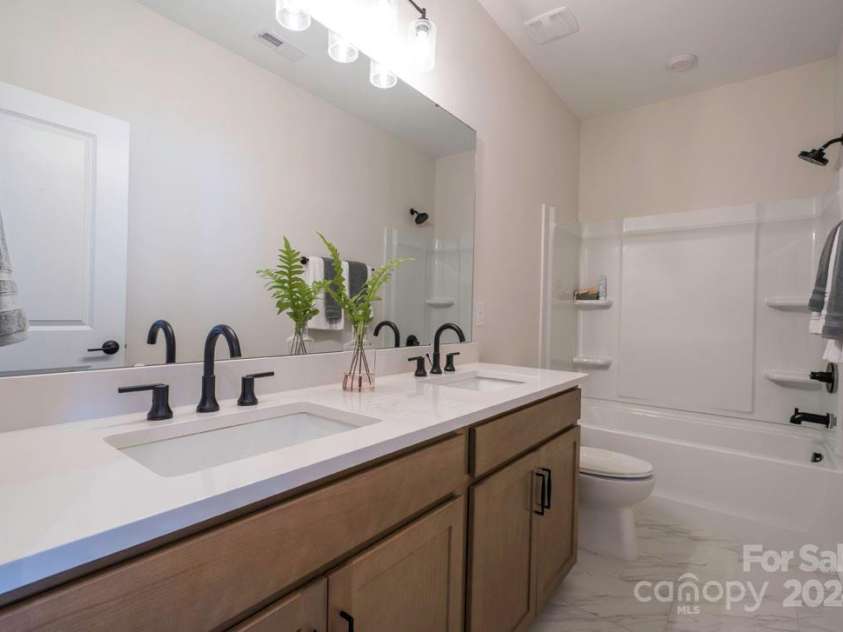 5919 Wetlands Alley, Charlotte, NC 28215.  MLS# CAR4145900, YatesRealty ID 21213. Trellis at Farmington | Plan 1 Model Home