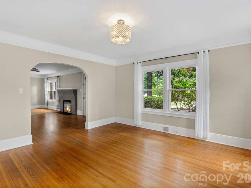 1050 Old Charlotte Road, Concord, NC 28027.  MLS# CAR4377115, YatesRealty ID 21214. Dining Room through arched opening