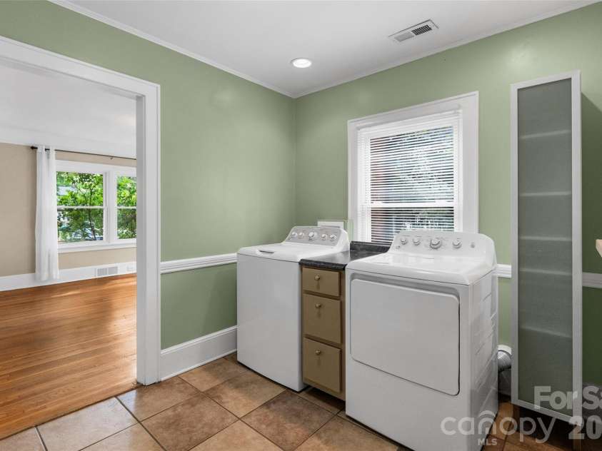 1050 Old Charlotte Road, Concord, NC 28027.  MLS# CAR4377115, YatesRealty ID 21214. Laundry Area and pantry between DR and Kitchen