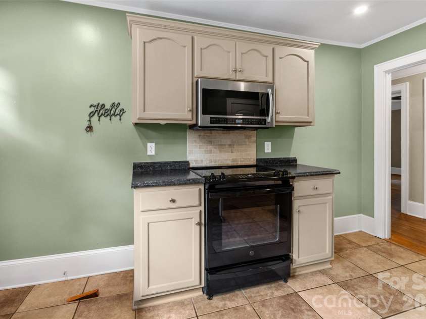 1050 Old Charlotte Road, Concord, NC 28027.  MLS# CAR4377115, YatesRealty ID 21214. Range wall