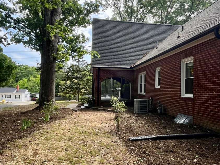 1050 Old Charlotte Road, Concord, NC 28027.  MLS# CAR4377115, YatesRealty ID 21214. Side of the home