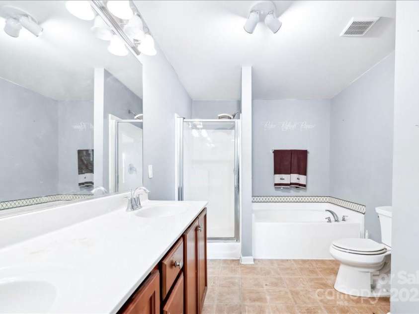 5879 Odenton Lane, Pfafftown, NC 27040.  MLS# CAR4217306, YatesRealty ID 21215. Master Bathroom
