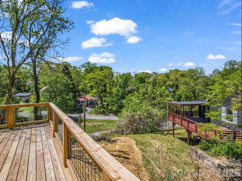 18 Worley Place, Asheville, NC 28806.  MLS# CAR4366279, YatesRealty ID 21222. Back deck off kitchenand primary room