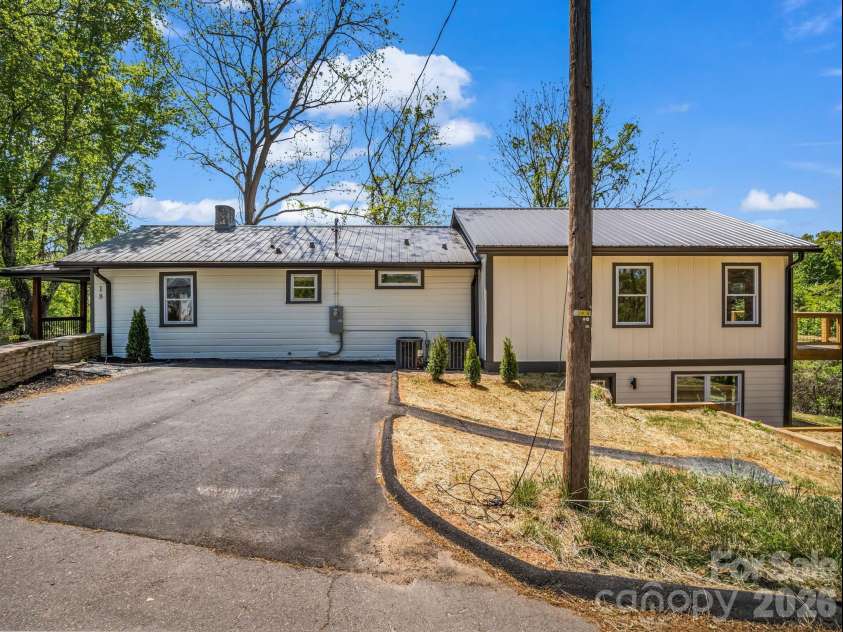 18 Worley Place, Asheville, NC 28806.  MLS# CAR4366279, YatesRealty ID 21222. Driveway and side view