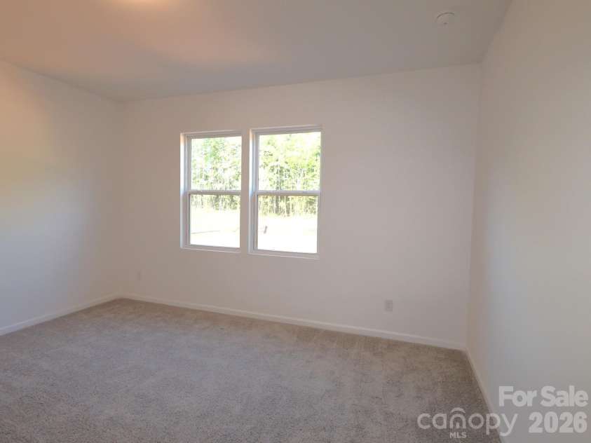 217 Amber Glen Drive, Locust, NC 28097.  MLS# CAR4373453, YatesRealty ID 21226. First floor bedroom