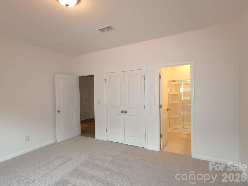 217 Amber Glen Drive, Locust, NC 28097.  MLS# CAR4373453, YatesRealty ID 21226. First floor bedroom