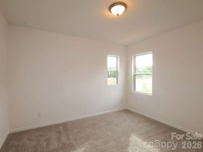 217 Amber Glen Drive, Locust, NC 28097.  MLS# CAR4373453, YatesRealty ID 21226. Secondary bedroom