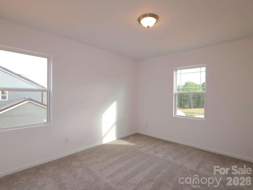 217 Amber Glen Drive, Locust, NC 28097.  MLS# CAR4373453, YatesRealty ID 21226. Secondary bedroom