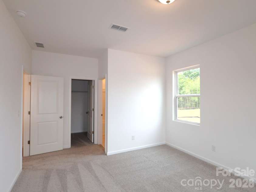 217 Amber Glen Drive, Locust, NC 28097.  MLS# CAR4373453, YatesRealty ID 21226. Secondary bedroom