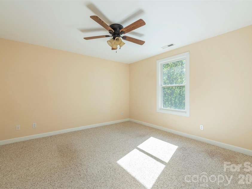 75 Noble Road, Fairview, NC 28730.  MLS# CAR4351168, YatesRealty ID 21230. Upper level bedroom