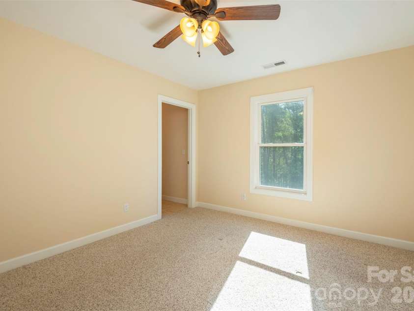 75 Noble Road, Fairview, NC 28730.  MLS# CAR4351168, YatesRealty ID 21230. Upper level bedroom